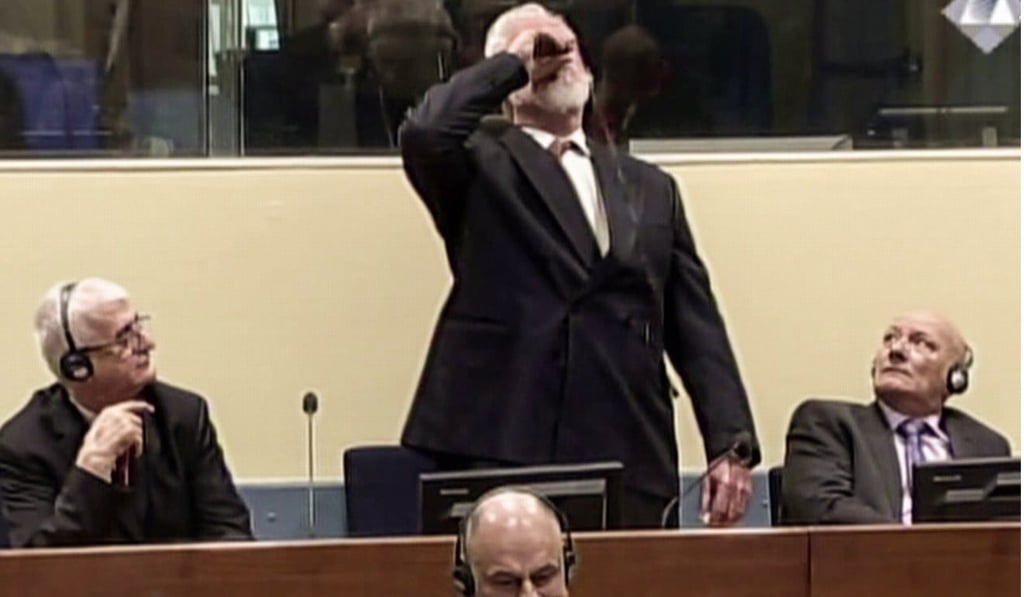 Croatian former general Slobodan Praljak swallowing poison during his judgement at the UN war crimes court to protest the upholding of a 20-year jail term. Photo: AFP/ICTY