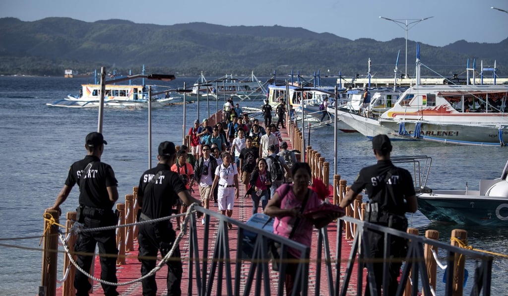 Tourists arrive at the Philippine island of Boracay after its reopening. Photo: AFP