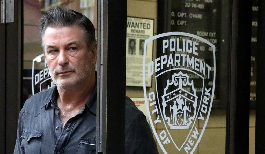 Actor Alec Baldwin exits the 6th precinct of the New York Police Department in Manhattan on Friday after being charged with assault and harassment. Photo: Reuters