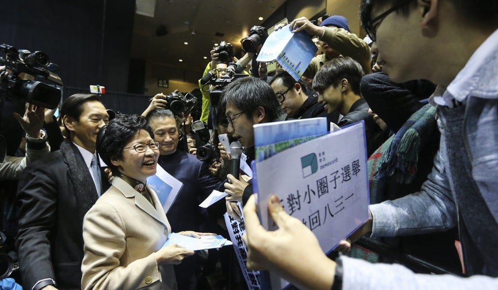 Carrie Lam, then a chief executive hopeful, meets protesters after announcing her full election manifesto in Mong Kok in February 2017. One of the grievances expressed by protesters, which included Raphael Wong of the League of Social Democrats and Joshua Wong of Demosisto, was the small pool of Beijing-approved candidates eligible for Hong Kong’s top job. Photo: Sam Tsang