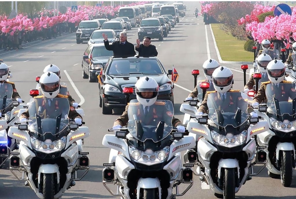 North Korean leader Kim Jong-un and Cuba’s President Miguel Diaz-Canel wave from a motorcade in Pyongyang, North Korea, on Sunday. Photo: AFP North Korean leader Kim Jong-un and Cuba’s President Miguel Diaz-Canel wave from a motorcade in Pyongyang, North Korea, on Sunday. Photo: AFP