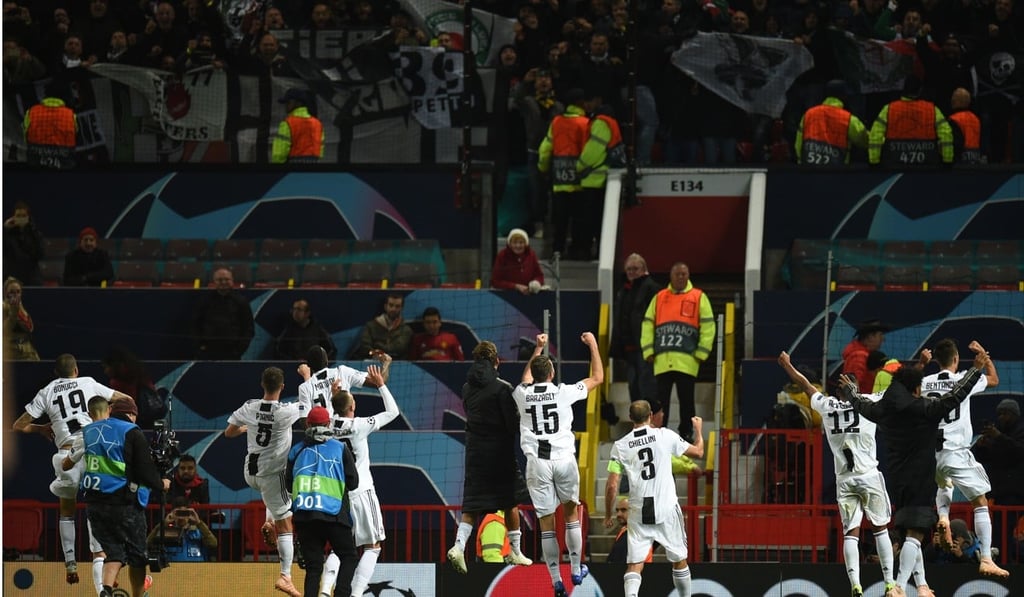 Juventus players celebrate with their supporters after the Champions League group H win over Manchester United last month. Photo: AFP
