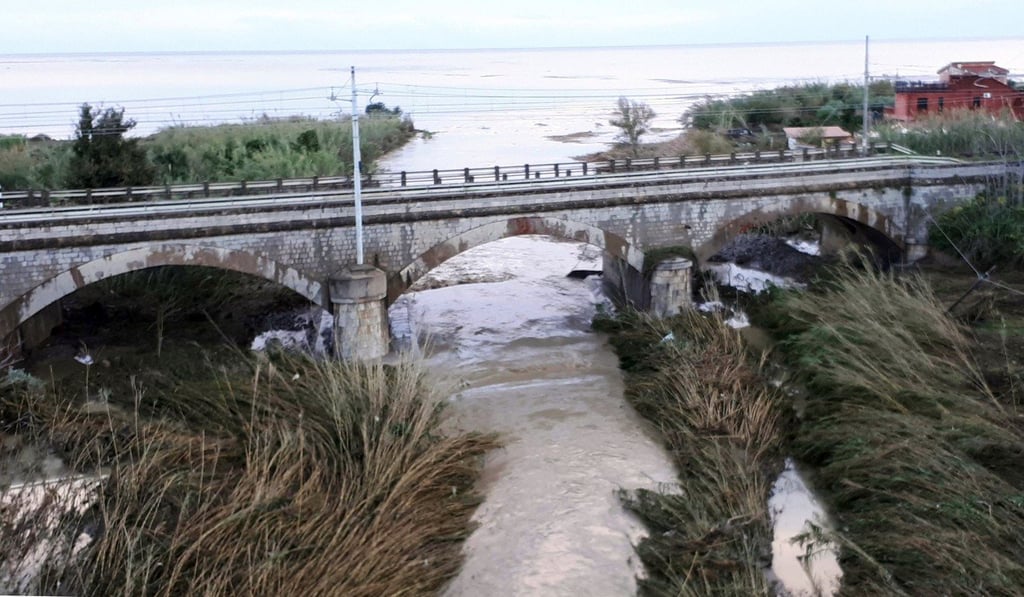 The swollen Milicia river runs in the area where nine people lost their lives when their home was flooded in Casteldaccia, near Palermo. Photo: AP