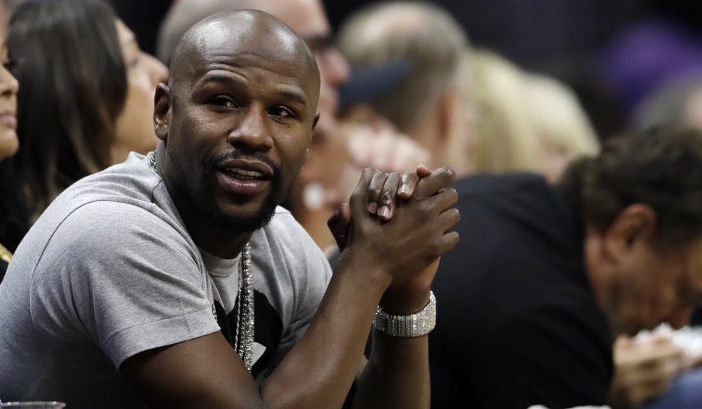 Floyd Mayweather Jnr watches an NBA game between the Los Angeles Clippers and the Denver Nuggets. Photo: AP