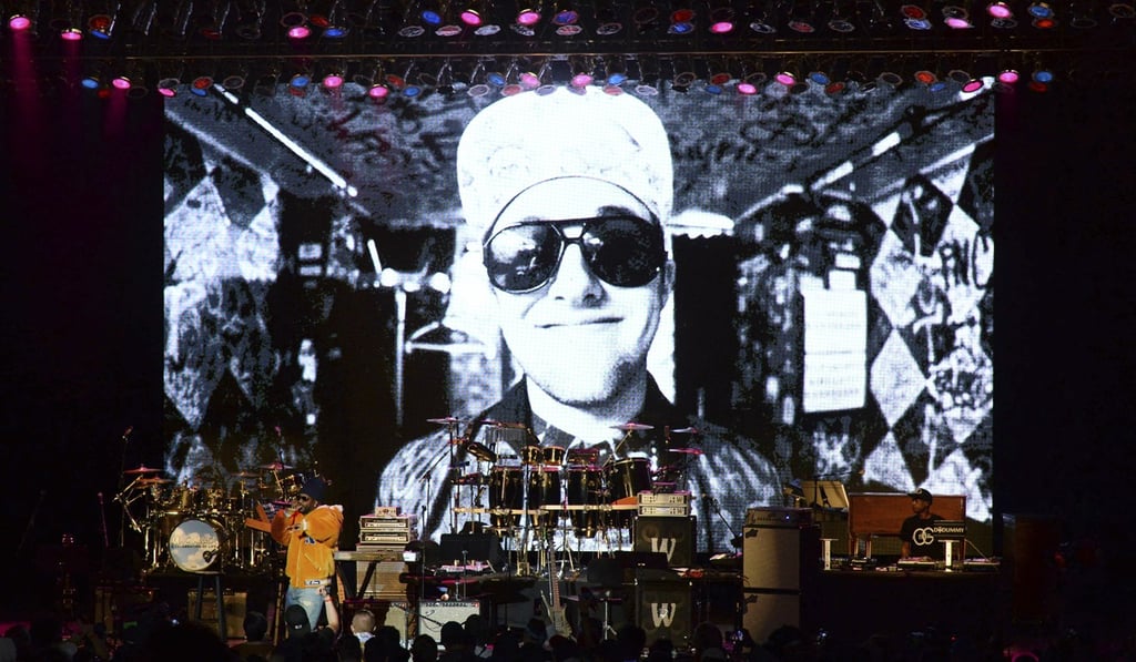 Juicy J performs during the tribute event Mac Miller: A Celebration of Life last Wednesday at the Greek Theatre in Los Angeles. Pictured on screen is the late rapper Mac Miller. Photo: AP Juicy J performs during the tribute event Mac Miller: A Celebration of Life last Wednesday at the Greek Theatre in Los Angeles. Pictured on screen is the late rapper Mac Miller. Photo: AP
