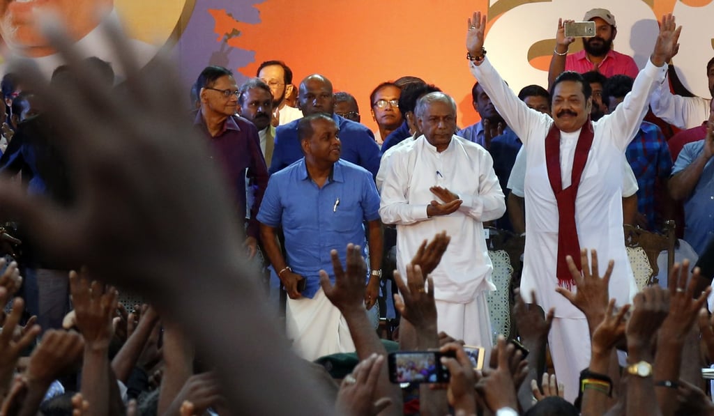 Rajapaksa acknowledges the crowd at a solidarity rally in Colombo on November 5 2018. Photo: EPA Rajapaksa acknowledges the crowd at a solidarity rally in Colombo on November 5 2018. Photo: EPA