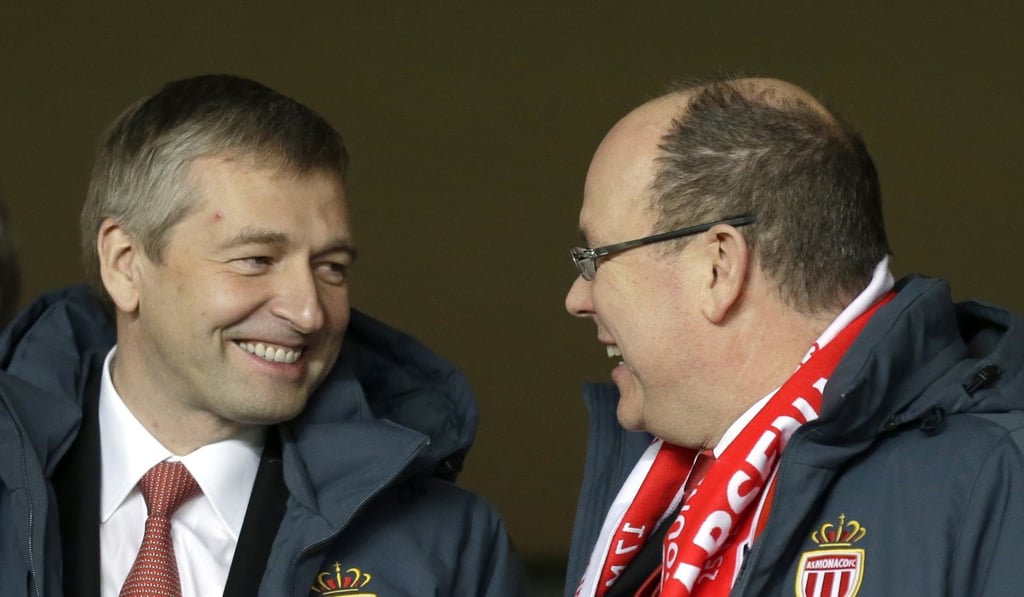 Prince Albert II of Monaco, right, and the president of AS Monaco Dmitry Rybolovlev discuss in the stands before the Champions League round of 16 second leg soccer match between Monaco and Arsenal at Louis II stadium in Monaco. Photo: AP Photo Prince Albert II of Monaco, right, and the president of AS Monaco Dmitry Rybolovlev discuss in the stands before the Champions League round of 16 second leg soccer match between Monaco and Arsenal at Louis II stadium in Monaco. Photo: AP Photo
