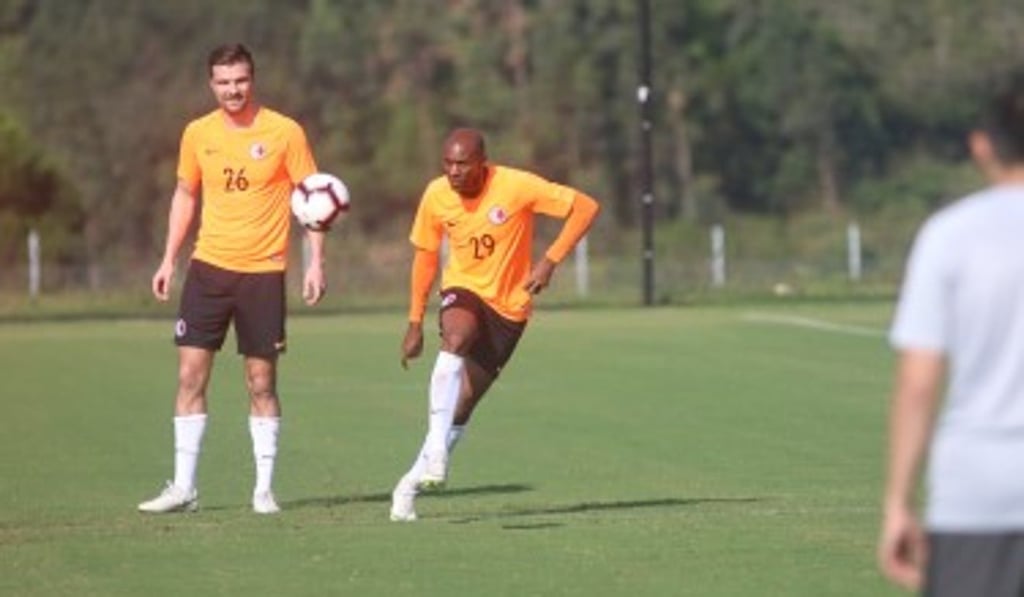 Andrew Russel and Sandro practise shooting.