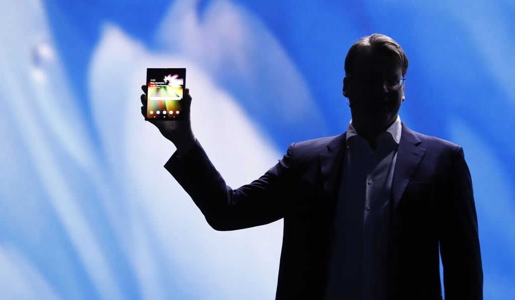 Justin Denison, Samsung Electronics senior vice-president of Mobile Product Marketing, displays Samsung's new foldable screen smartphone, during the Samsung Developers Conference in San Francisco on Wednesday. Photo: Reuters