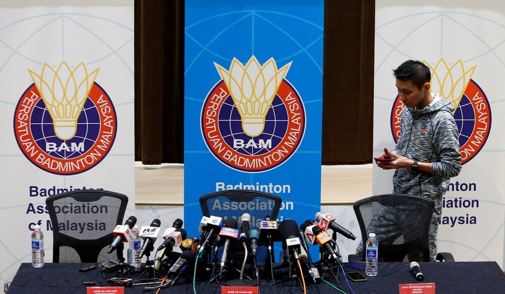 Lee Chong Wei gets ready to speak to the press. Photo: Reuters