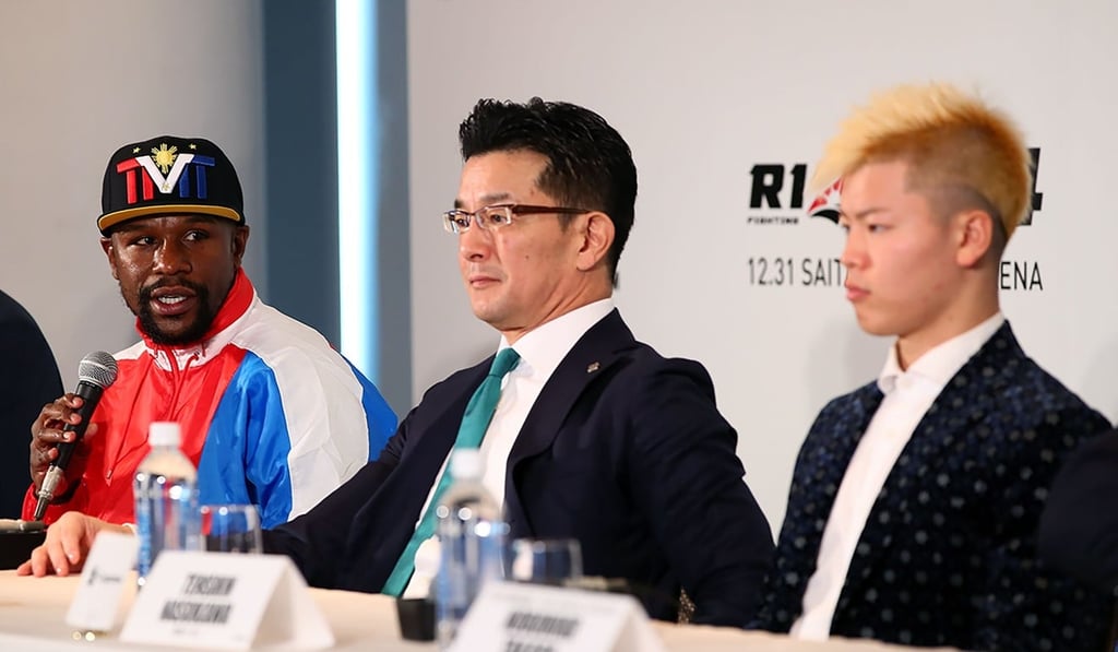 Floyd Mayweather (left) claims he did not want to ‘create a huge disturbance’ at the press conference. Photo: AFP