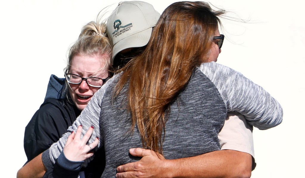 Mourners react outside a reception centre for families of victims of a mass shooting in Thousand Oaks, California, on Thursday. Photo: Reuters