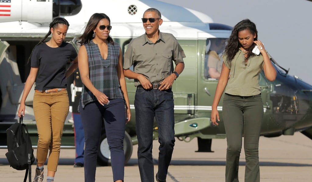 Then US president Barack Obama and Michelle Obama and their daughters Malia (left) and Sasha (right) walk to Air Force One as they depart from Roswell, New Mexico, on June 17, 2016. Photo: Reuters