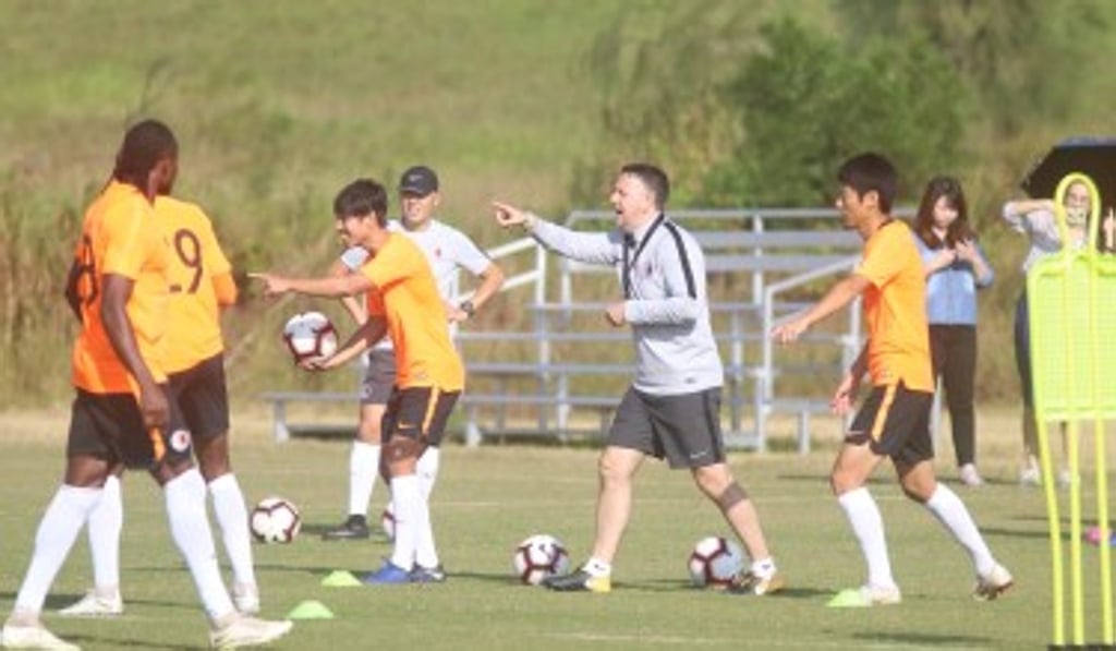 Coach Gary White overseas a training session with the Hong Kong team.