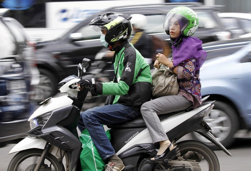 Indonesian tech start-up Go-Jek, which started with a motorcycle ride-hailing operation in 2010, has expanded its business to include everything from meal deliveries to over-the-counter medicine and massage services on-demand through its super app. Photo: Reuters