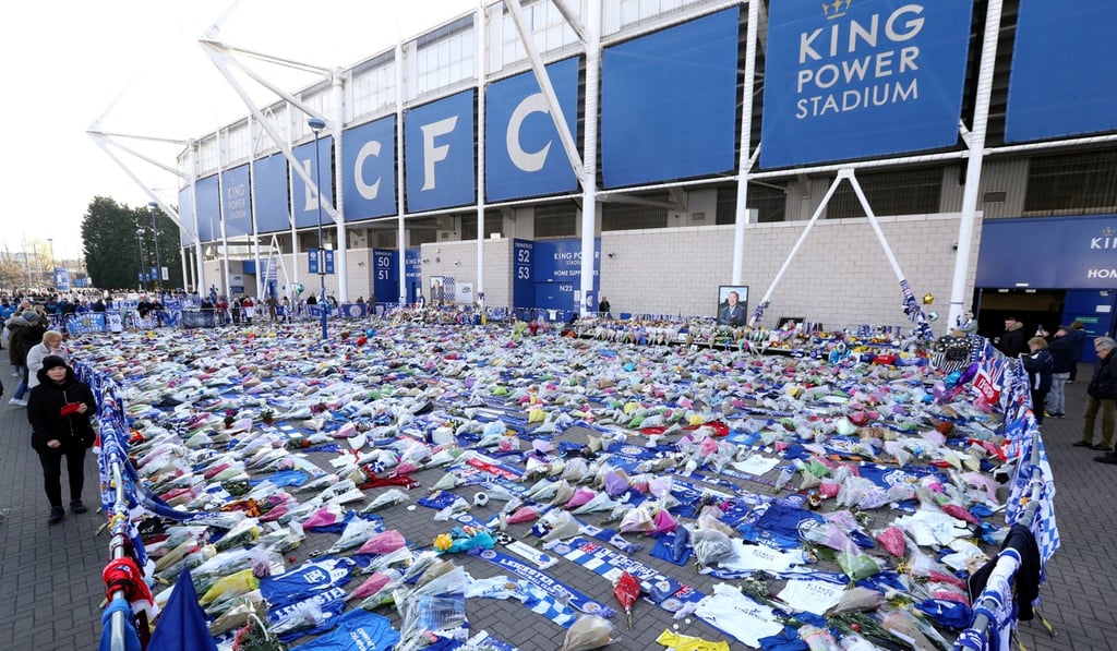 Tributes left for Vichai Srivaddhanaprabha and four other people who died when the helicopter they were travelling in crashed as it left the King Power Stadium. Photo: Reuters