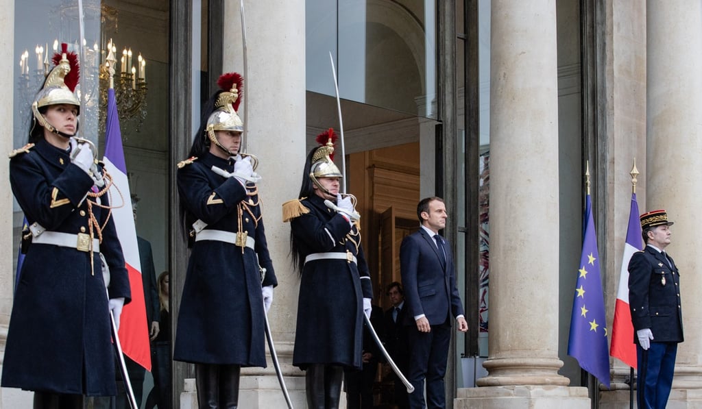 Emmanuel Macron, France's president, centre right, waits to greet US President Donald Trump, not pictured, at the Elysee Palace during first world war commemoration ceremonies in Paris. Photo: Bloomberg