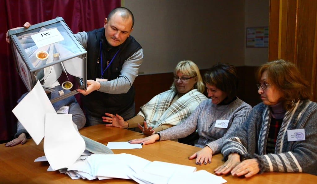 Election commission members count ballots at polling station in Donetsk, in the rebel-held area of eastern Ukraine. Photo: AFP