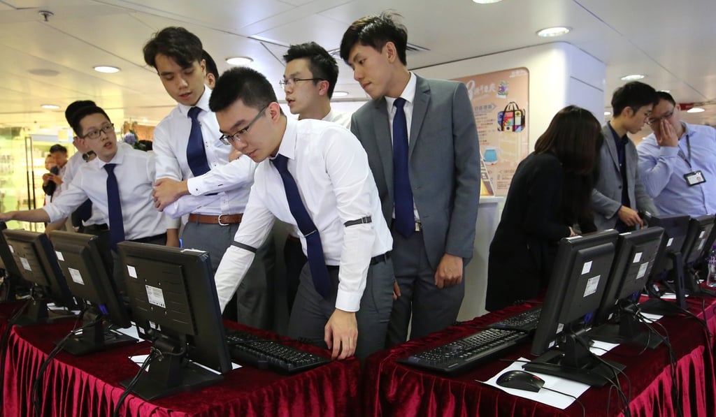 Prospective buyers at the sales office of One East Coast in Mong Kok. Photo: Edmond So/SCMP