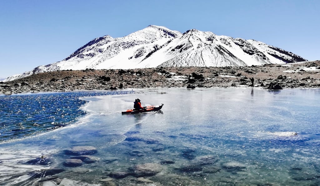Dan Bull breaks the ice to make a channel for his world record attempt.