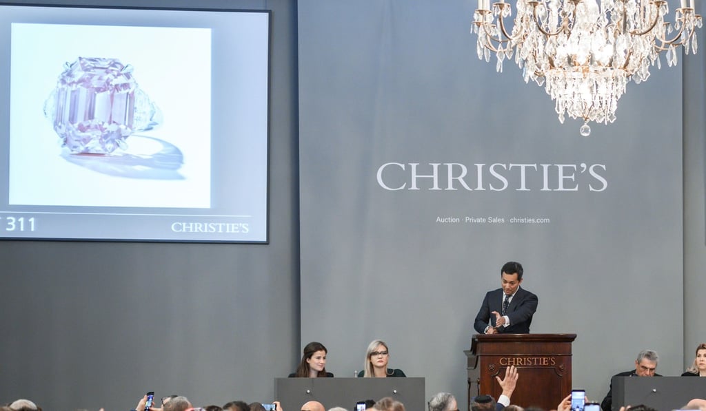 Christie’s jewellery department head Rahul Kadakia holds the hammer during the sale of The Pink Legacy on Tuesday in Geneva, Switzerland. Photo: Agence France-Presse