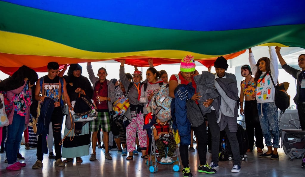 Members of the LGBT community, who separated from the larger caravan of Central American migrants travelling through Mexico, arrive on Monday at the border city of Tijuana, from where they will ask for asylum in the United States. Photo: EPA