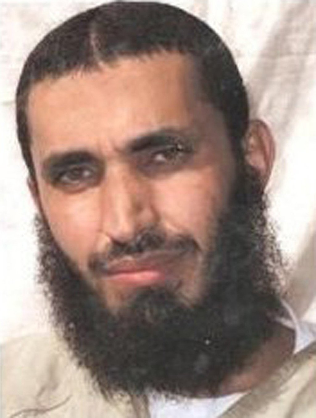 Abdel Malik Wahab al-Rahabi is seen here posing for his family at Guantanamo Bay. Since his release, he has moved to Sudan. Photo: TNS Abdel Malik Wahab al-Rahabi is seen here posing for his family at Guantanamo Bay. Since his release, he has moved to Sudan. Photo: TNS