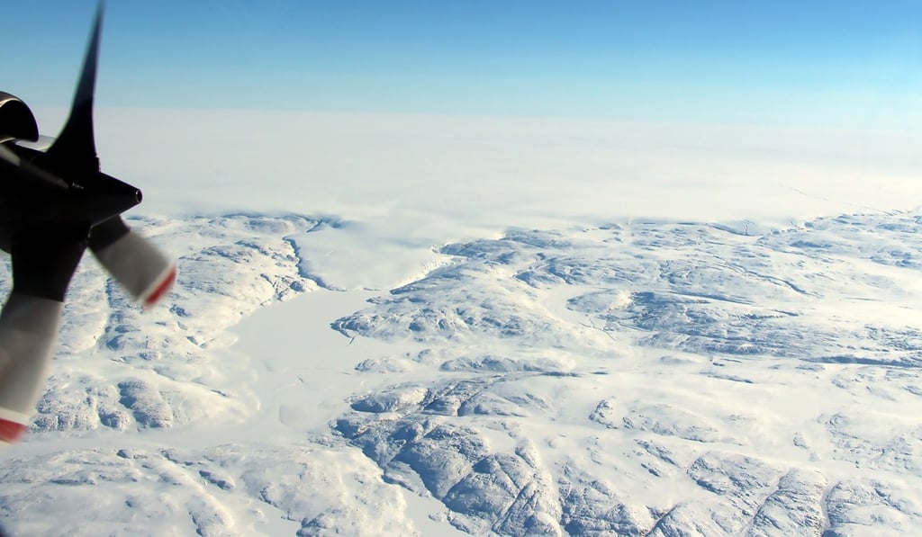 The Hiawatha impact crater covered by the Greenland Ice Sheet and a tongue of ice that breaches the crater’s rim. Photo: AFP