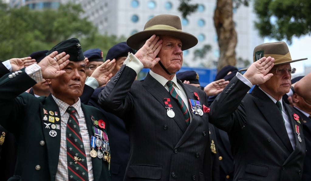 Veterans salute during a Remembrance Day ceremony at the Cenotaph in Hong Kong on November 11, honouring members of the armed forces who died in the line of duty in the first world war. It is 100 years since the war ended. Photo: AFP Veterans salute during a Remembrance Day ceremony at the Cenotaph in Hong Kong on November 11, honouring members of the armed forces who died in the line of duty in the first world war. It is 100 years since the war ended. Photo: AFP