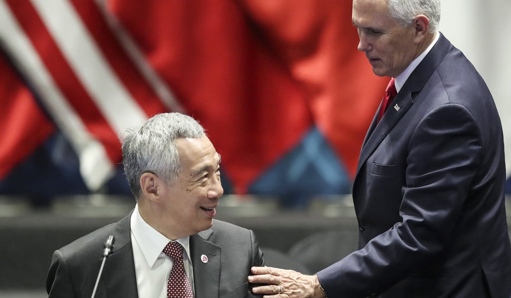 US Vice-President Mike Pence speaks with Singaporean Prime Minister Lee Hsien Loong during the gathering. Photo: AP US Vice-President Mike Pence speaks with Singaporean Prime Minister Lee Hsien Loong during the gathering. Photo: AP
