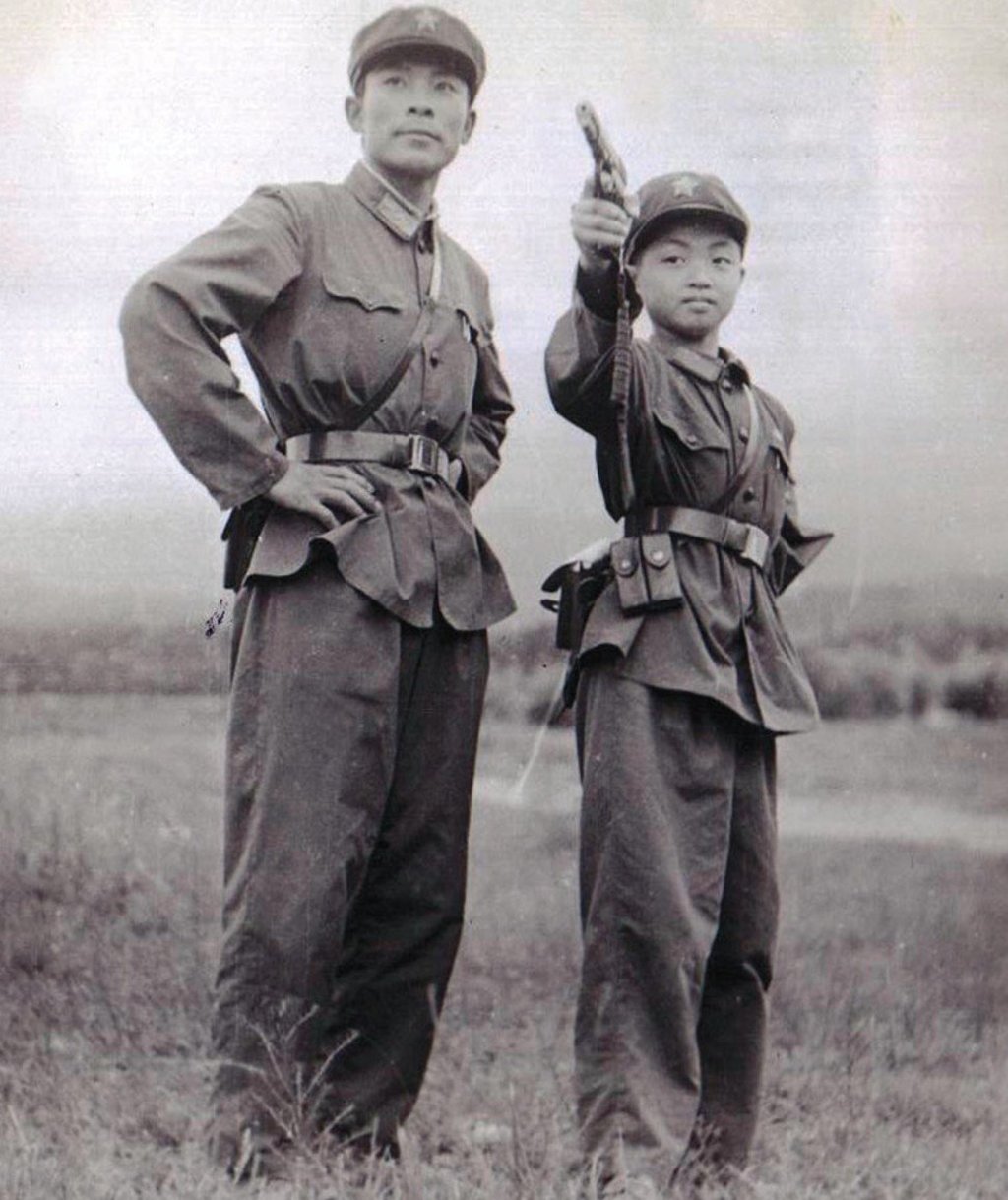 Jin Xing (right) in the People's Liberation Army’s aged nine.