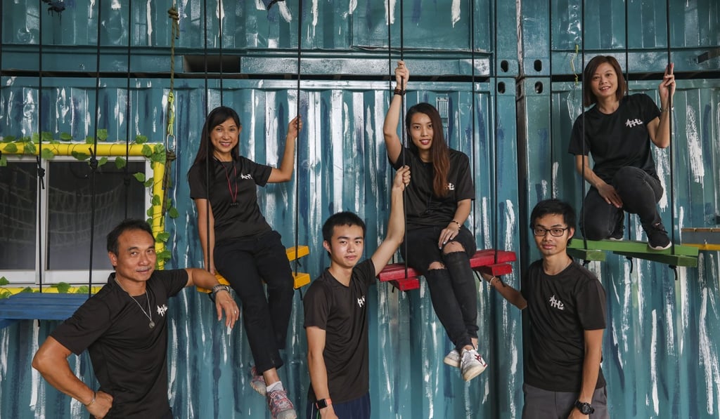 Tin Kwan-lung (right, in glasses), and Brian Chan (front row, centre) with other staff members of the charity. Photo: Xiaomei Chen