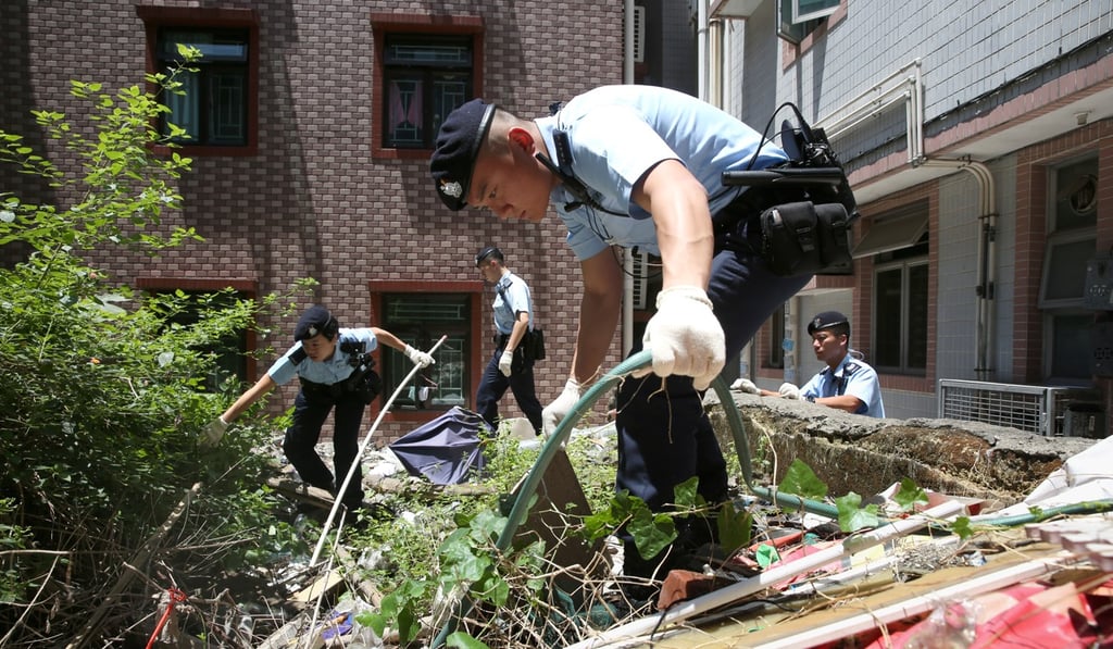 Police search for evidence at the Tin Sam Tsuen village in Yuen Long. Photo: Sam Tsang