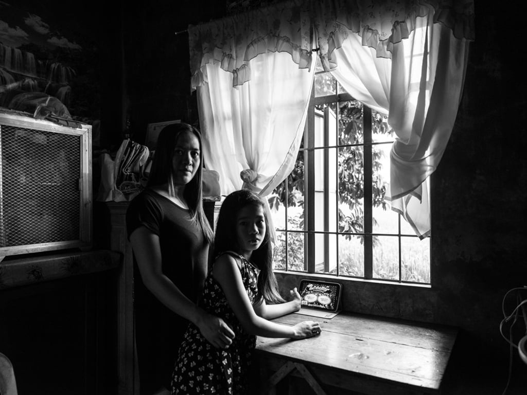 Five years ago, Razel Anne asked Xyza’s mother to help her find a job in Hong Kong. As the cost of living in the Philippines increased, Razel was worried about her daughter Tanisha’s future. Tanisha was three when Razel left. Razel is aware that her daughter has found it very difficult to cope with the separation. But she believes that it is only by leaving that Tanisha will have a brighter future, even if that means she has to put up with exhaustion, insomnia and the feeling of despondence that springs up all the time. Photo: Xyza Cruz Bacani Five years ago, Razel Anne asked Xyza’s mother to help her find a job in Hong Kong. As the cost of living in the Philippines increased, Razel was worried about her daughter Tanisha’s future. Tanisha was three when Razel left. Razel is aware that her daughter has found it very difficult to cope with the separation. But she believes that it is only by leaving that Tanisha will have a brighter future, even if that means she has to put up with exhaustion, insomnia and the feeling of despondence that springs up all the time. Photo: Xyza Cruz Bacani