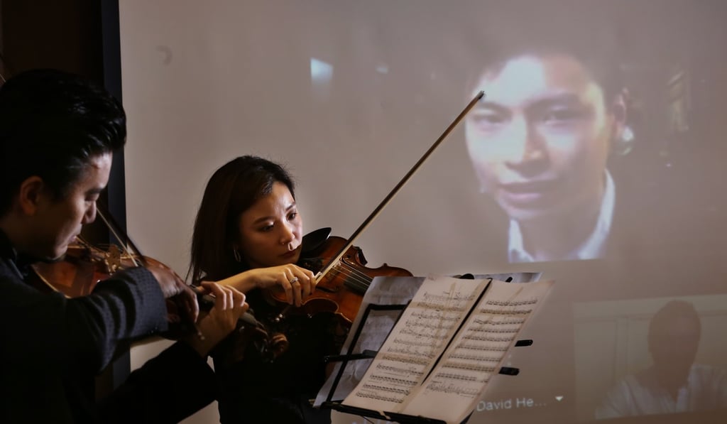 Hong Kong Philharmonic concertmaster Wang Jing performs in 2015 with Zhao Yingna, also of the Philharmonic, at HKUST Business School Central Facility in Central in 2015. Photo: Nora Tam