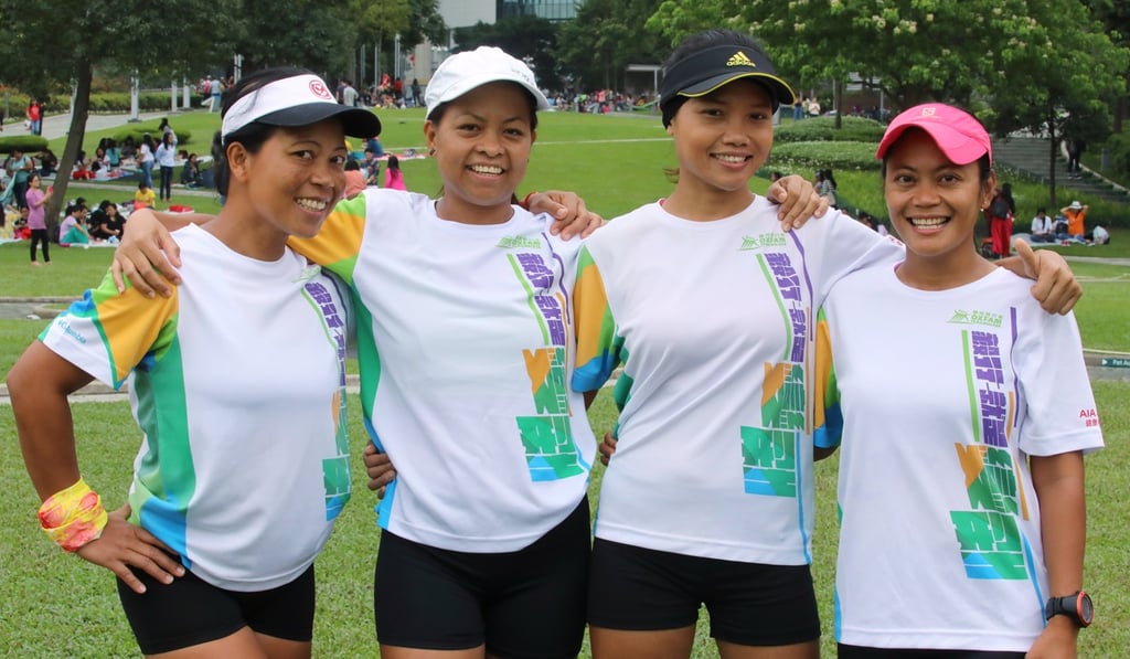 (From left) Milkhatus Sholikah, Aleli Pena, Rosie Rusinah, and Eden Marciano pose before the race. Photo: Jonathan Wong