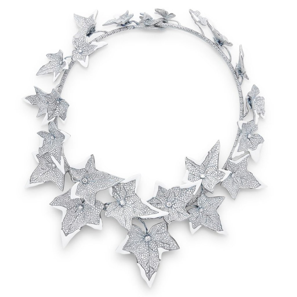 A Boucheron Lierre Givré necklace set with cacholong, paved with diamonds, on titanium. A Boucheron Lierre Givré necklace set with cacholong, paved with diamonds, on titanium.