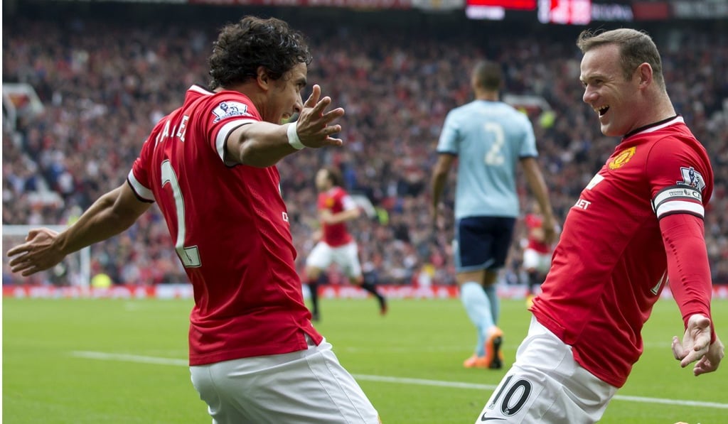 Rafael Pereira da Silva celebrates with Wayne Rooney during their time at Manchester United. Photo: AP