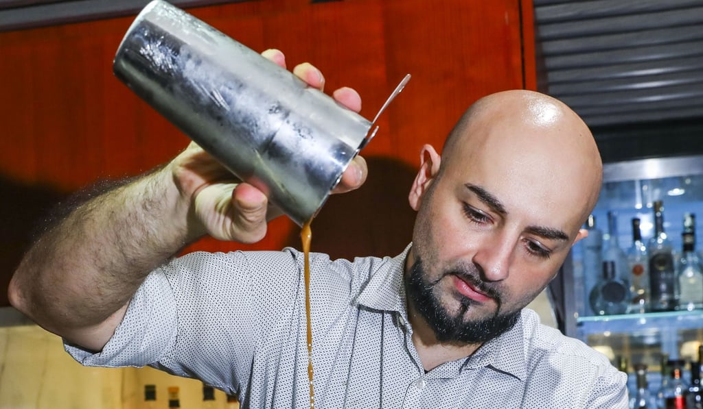 Jonny Amir, bar manager of Beefbar, in Club Lusitano in Central, prepares a Tiramisu dessert drink. Photo: Edmond So
