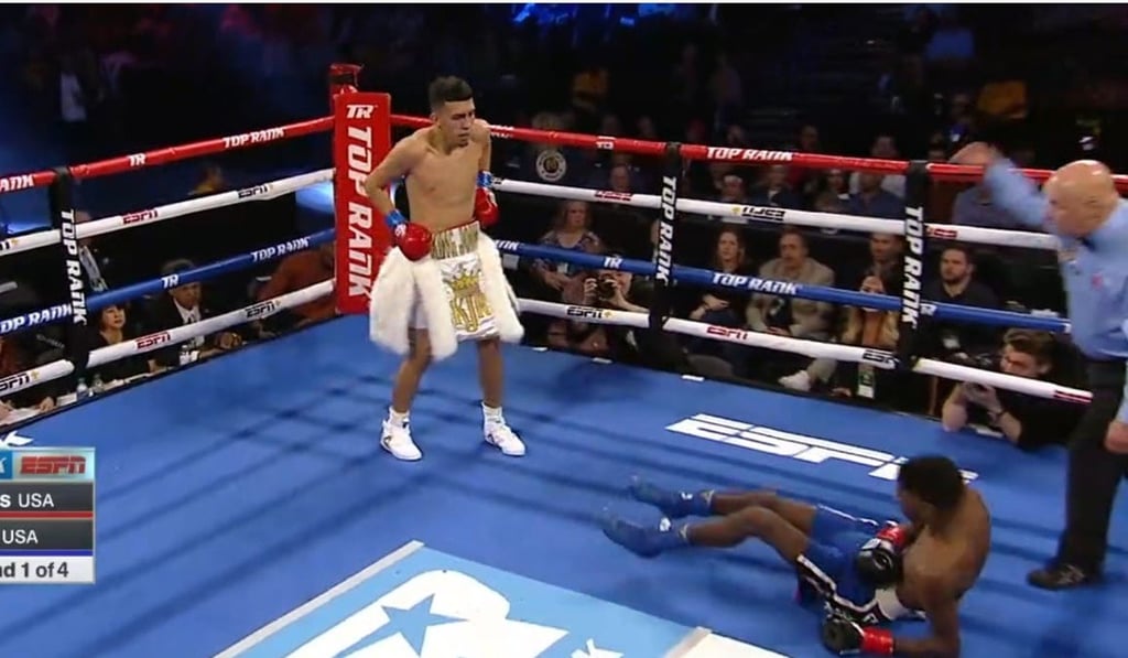 Emanuel Williams goes crashing down to the canvas by John Rincon. Photo: Twitter