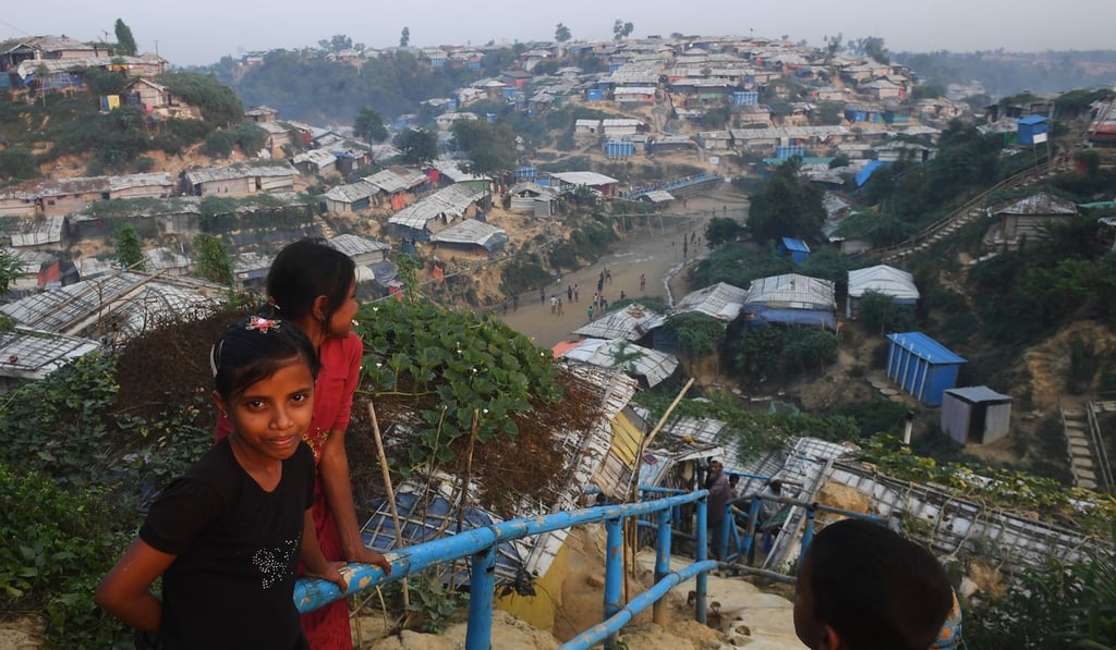 Young Rohingya refugees look on as they return to their tent at the Hakimpara refugee camp on November 18, after many fled to avoid being repatriated to Myanmar. Photo: AFP