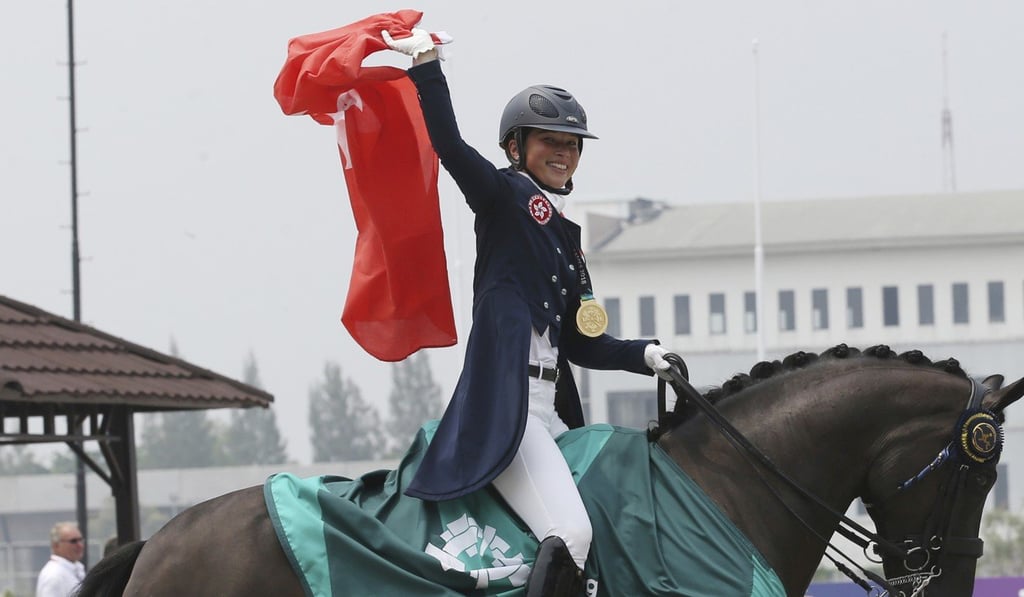 Jacqueline Siu celebrates after winning gold in the individual dressage at the Asian Games in Jakarta. Photo: AP