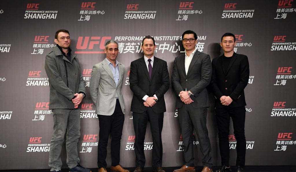 UFC executives Forrest Griffin, Andrew Schleimer, Lawrence Epstein and Kevin Chang are joined by Chinese fighter Wang Guan at the launch of the UFC Performance Institute in Shanghai.
