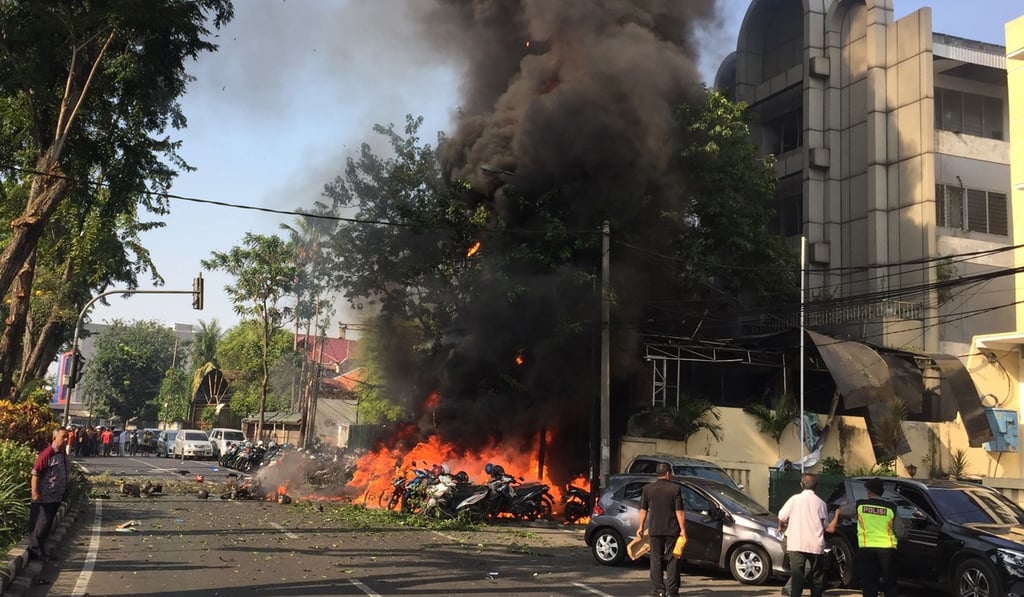 Police investigate an explosion outside the Surabaya Centre Pentecostal Church. A series of blasts, including at least one suicide bombing, struck churches in Indonesia on May 13, killing at least 11 people and wounding dozens. Photo: AFP