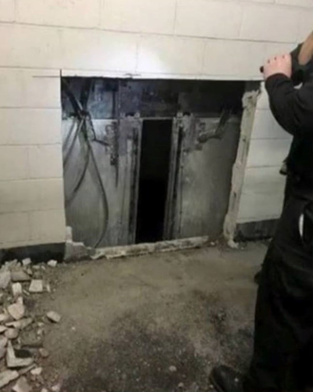 A scene from the rescue of six passengers in the Chicago skyscraper formerly known as the John Hancock Centre. Rescuers had to smash a hole in a wall to access the lift. Photo: Chicago Fire Department A scene from the rescue of six passengers in the Chicago skyscraper formerly known as the John Hancock Centre. Rescuers had to smash a hole in a wall to access the lift. Photo: Chicago Fire Department