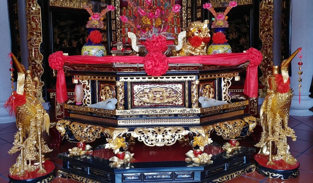 A finely carved wooden table, decorated with gold, in a shrine in Chaozhou. Photo: Anven Wu