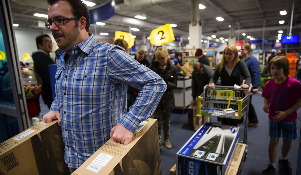 Shoppers throng the Best Buy store at Northgate Mall in Seattle during the Thanksgiving holiday. Consumer confidence is high in the US, supported by healthy household balance sheets and a strong job market. Photo: TNS Shoppers throng the Best Buy store at Northgate Mall in Seattle during the Thanksgiving holiday. Consumer confidence is high in the US, supported by healthy household balance sheets and a strong job market. Photo: TNS