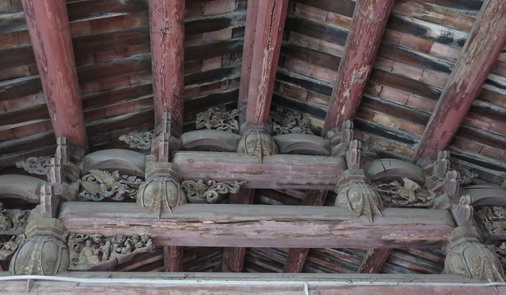 Wooden beams, exquisitely carved during the Ming dynasty, inside an ancestral hall in Chaozhou. Photo: Anven Wu