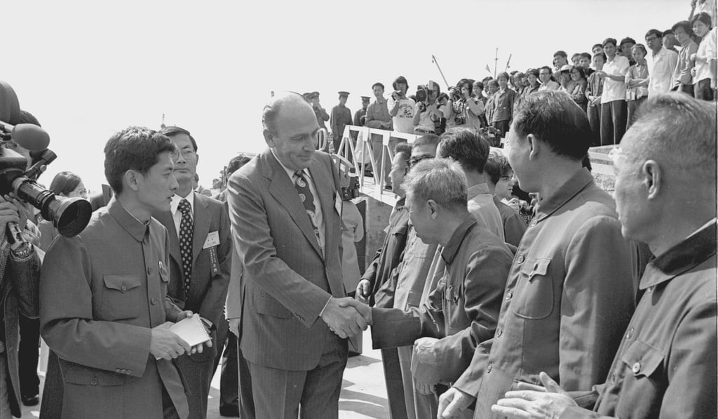 Malcolm Alexander, Hong Kong’s Director of Marine, is welcomed by Chinese officials on his arrival at the pier in Whampoa, Canton, on November 17, 1978.
