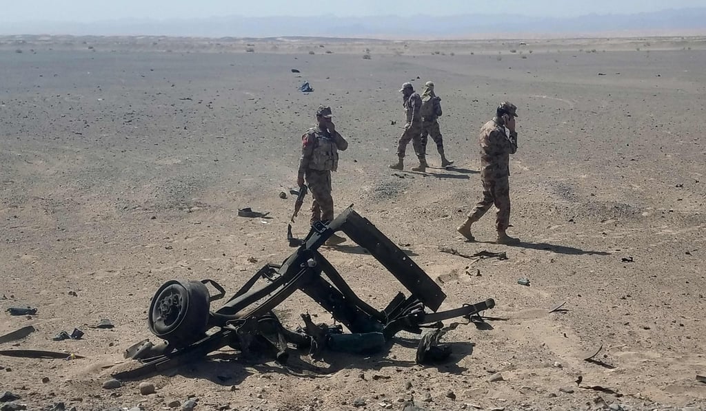 Pakistani security personnel inspect the site of a suicide attack in Dalbandin, about 340 kilometres from Quetta, the capital of Balochistan province. Photo: AFP